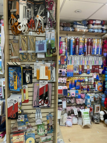 Racks of Knitting needles, Crochet Hooks, and wool